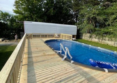 image of an above ground pool deck built by jc tree care
