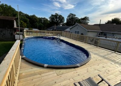 image of an above ground pool deck built by jc tree care